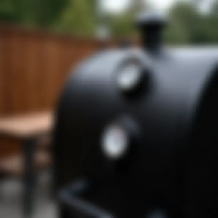 A close-up view of a high-quality BBQ smoker's control panel and temperature gauge.