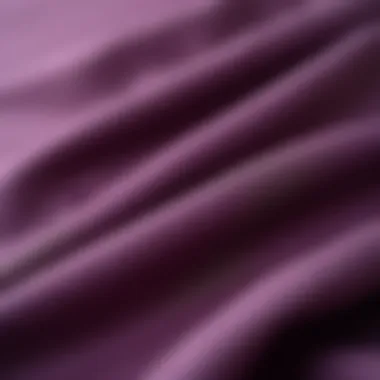 Close-up of plum fabric swatches with styling ideas for living room furniture