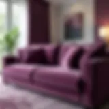 Plum colored sofa with stylish throw pillows in a modern living room